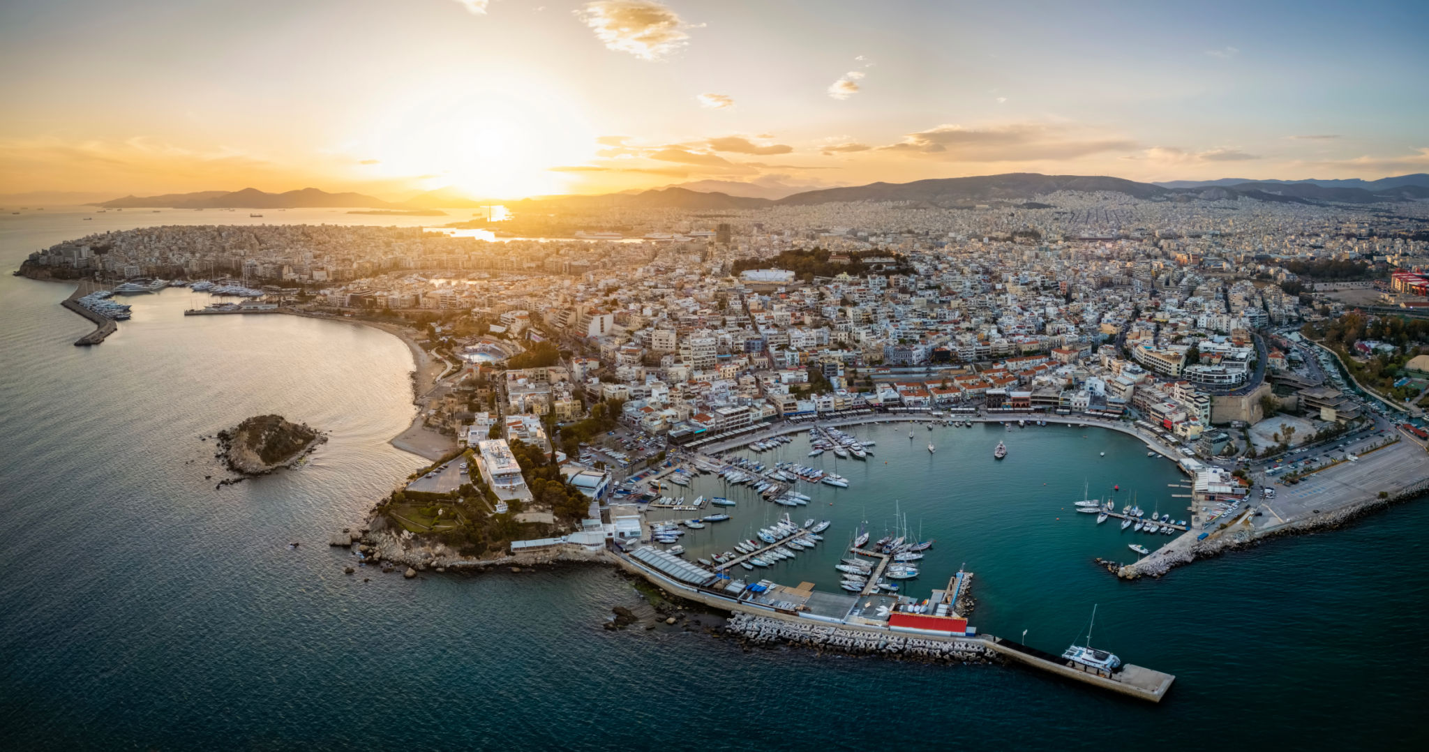 Aerial sunset view of the Piraeus district in Athens, Greece, with Mikrolimano and Zea Marina Aerial sunset view of the Piraeus district in Athens, Greece, with Mikrolimano and Zea Marina