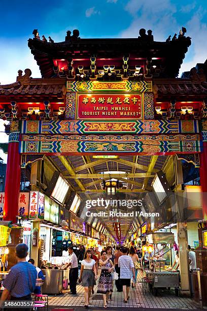 entrance to snake alley or taipei hwahsi (huaxi) tourist night market. - snake alley stock pictures, royalty-free photos & images