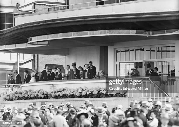 The party in the Royal Box on the second day of the Royal Ascot race meeting at Ascot Racecourse, Berkshire, 18th June 1952. In the centre is Queen...