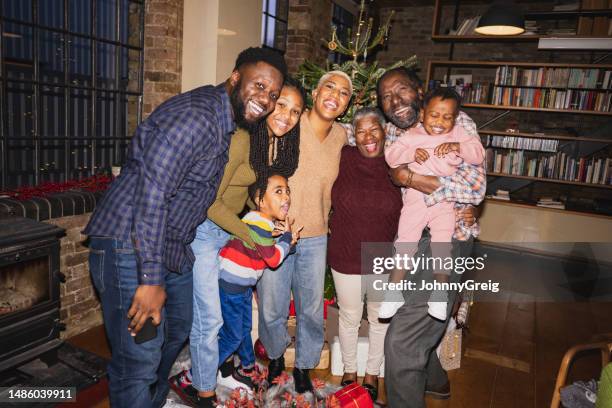 portrait of cheerful black family together for holiday - retro style man stock pictures, royalty-free photos & images