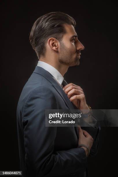 handsome elegant male posing for studio portrait - handsome stock pictures, royalty-free photos & images