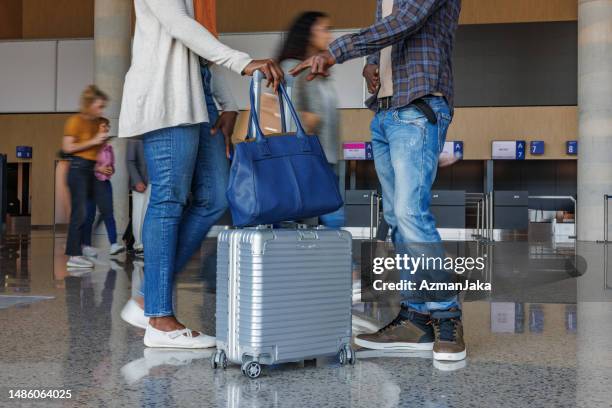 african mid-adult couple excited for their upcoming trip - carry on bag bildbanksfoton och bilder