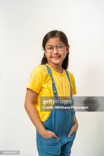 excited preschool small adorable girl in eyeglasses, - truehearts stock pictures, royalty-free photos & images