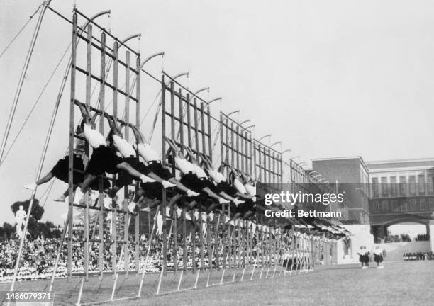 Girls from Italy's fascist youth organization, the Opera Nazionale Balilla, participating in a gymnastics demonstration at the Foro Mussolini in...