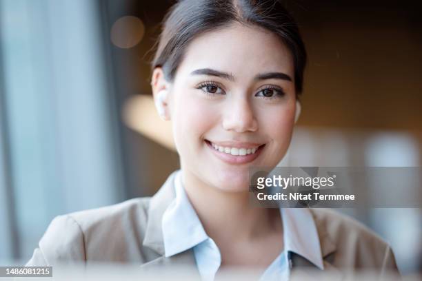 young entrepreneurs can learn and growth with great business opportunities and driven business operational with technologies. portrait of a young businesswoman with headphones seated at a business lounge. - frank rich stock pictures, royalty-free photos & images