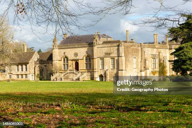 Lacock Abbey, Lacock, Wiltshire, England, UK photo taken from public road outside the grounds.