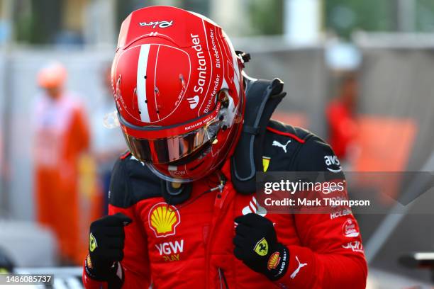 Pole position qualifier Charles Leclerc of Monaco and Ferrari celebrates in parc ferme during qualifying ahead of the F1 Grand Prix of Azerbaijan at...