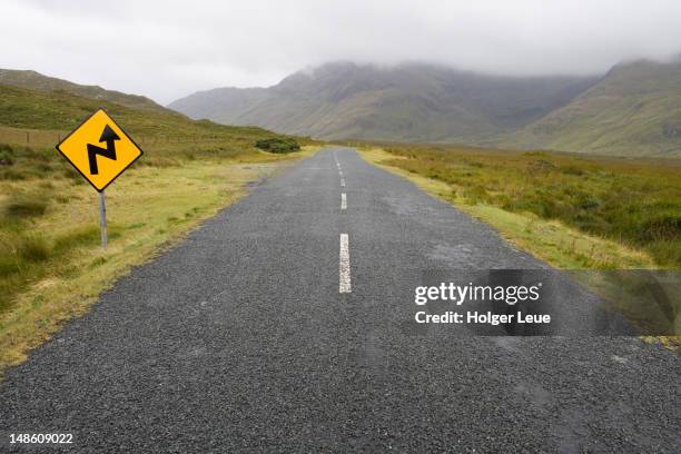 road leading off in to the countryside near delphi. - lead off stock pictures, royalty-free photos & images