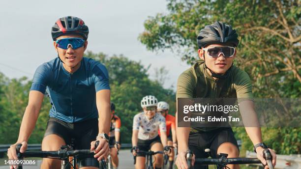 group of asian chinese cyclist cycling in rural area during weekend morning - goggles sportswear stock pictures, royalty-free photos & images