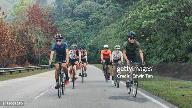 asian chinese cyclist cycling in rural area during weekend morning - cycling team stock pictures, royalty-free photos & images