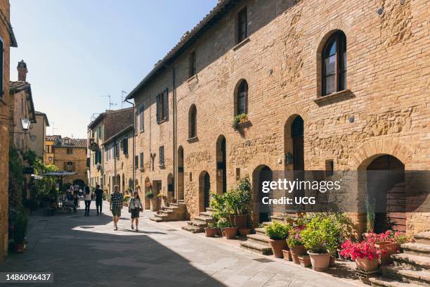 Pienza, Siena Province, Tuscany, Italy. Via Case Nuove. Typical street scene. Pienza is a UNESCO World Heritage Site.