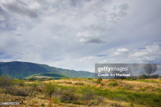 arid landscape of mountains, hills and valleys due to global warming - drought city stock pictures, royalty-free photos & images