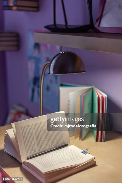 open and illuminated book on a youth desk - st georges day stock pictures, royalty-free photos & images