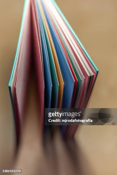 open and illuminated book on a youth desk - st georges day stock pictures, royalty-free photos & images