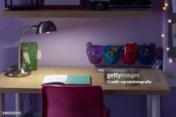 open and illuminated book on a youth desk - st georges day stock pictures, royalty-free photos & images