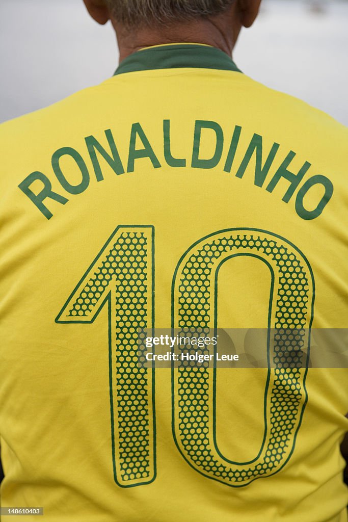 Back view of man wearing number 10 Ronaldinho Brazilian national soccer team football jersey.