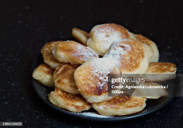 close-up of cookies in plate on table - cast iron stock pictures, royalty-free photos & images