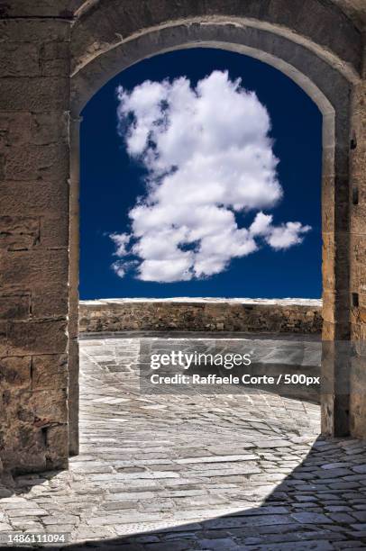 low angle view of old ruin against cloudy sky,poppi,arezzo,italy - raffaele corte stock pictures, royalty-free photos & images