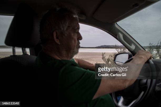 Eduardo, one of the guards of the Laguna de Fuente de Piedra drives through a path next to the dry lagoon due to the lack of rainfall due to the...