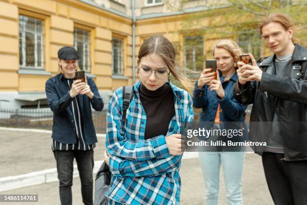 communication problems among teenagers , conflicts and disagreements - social media abuse stock-fotos und bilder