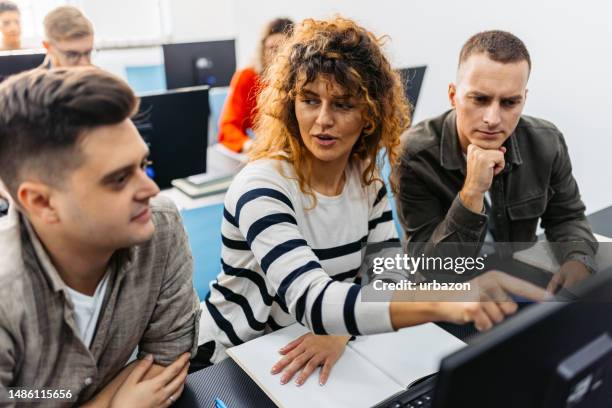 students working in groups in programing class - online seminar stock pictures, royalty-free photos & images