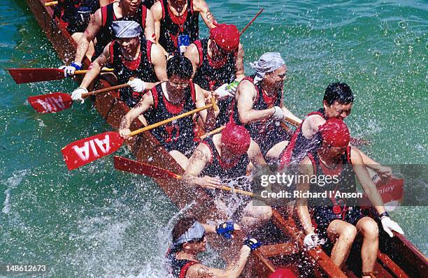 dragon boat races at stanley beach. - dragon boat racing stock pictures, royalty-free photos & images
