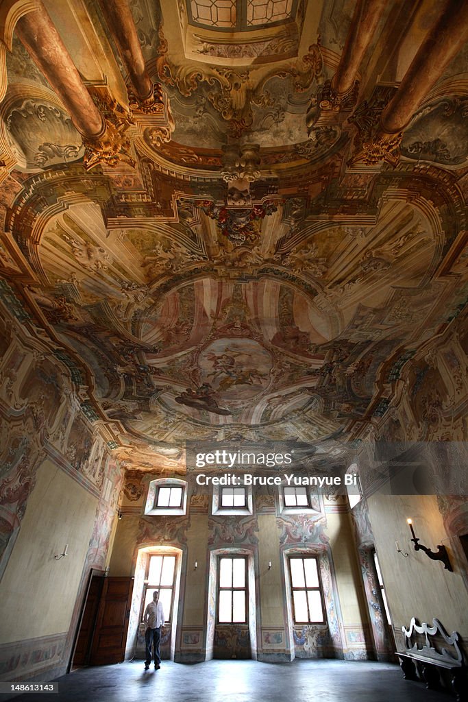 Interior Sertoli-Salis Palace with ornately decorated ceiling.