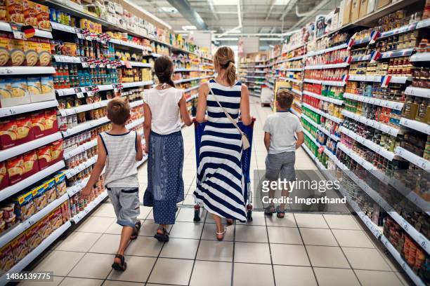 family doing shopping in a supermarket - alley bildbanksfoton och bilder