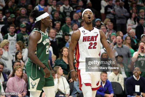 Jimmy Butler of the Miami Heat and Jrue Holiday of the Milwaukee Bucks exchange words during Game 5 of the Eastern Conference First Round Playoffs at...