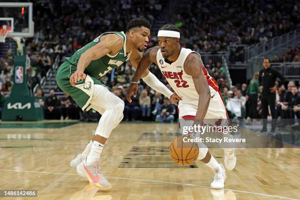 Jimmy Butler of the Miami Heat is defended by Giannis Antetokounmpo of the Milwaukee Bucks during Game 5 of the Eastern Conference First Round...