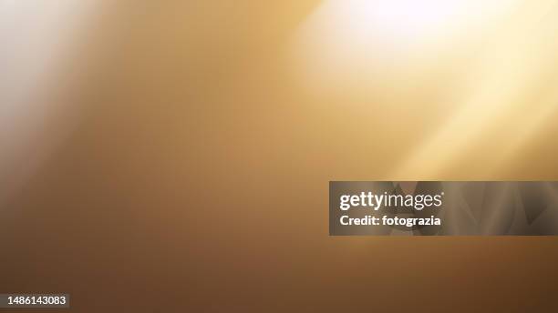 golden gradient light beam defocused background - illuminated stock pictures, royalty-free photos & images