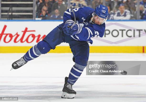 Jake McCabe of the Toronto Maple Leafs fires the puck in against the Tampa Bay Lightning during Game Five of the First Round of the 2023 Stanley Cup...