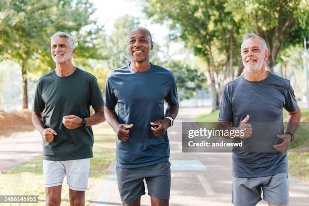 group and senior men training - race unity stock pictures, royalty-free photos & images