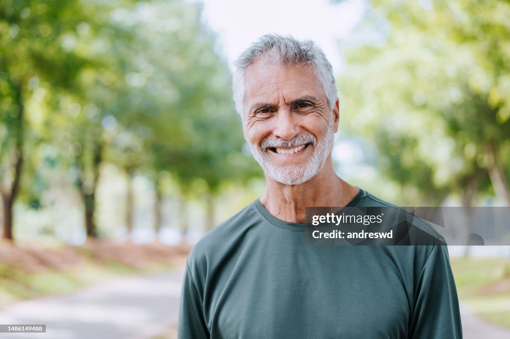 Portrait of a senior man on a workout in the public park
