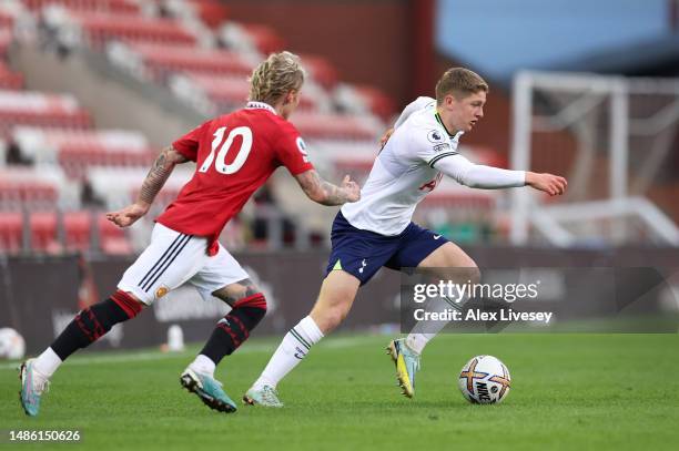 Matthew Craig of Tottenham Hotspur U21 beats Isak Hansen-Aaroen of Manchester United during the Premier League 2 match between Manchester United U21...