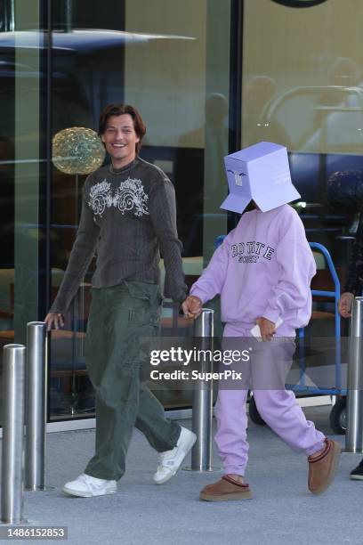 Jake Bongiovi and Millie Bobby Brown are seen at Malpensa airport on April 28, 2023 in Milan, Italy.