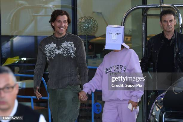 Jake Bongiovi and Millie Bobby Brown are seen at Malpensa airport on April 28, 2023 in Milan, Italy.