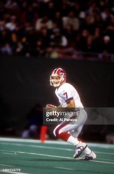 Quarterback Doug Flutie of the Buffalo Bills scrambles with the ball in the game between the Buffalo Bills vs the New York Jets at The Meadowlands on...