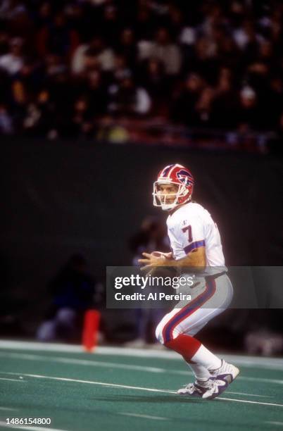 Quarterback Doug Flutie of the Buffalo Bills scrambles with the ball in the game between the Buffalo Bills vs the New York Jets at The Meadowlands on...