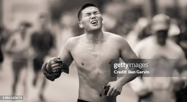 powerful marathon finish line celebration moment - athlete stock pictures, royalty-free photos & images