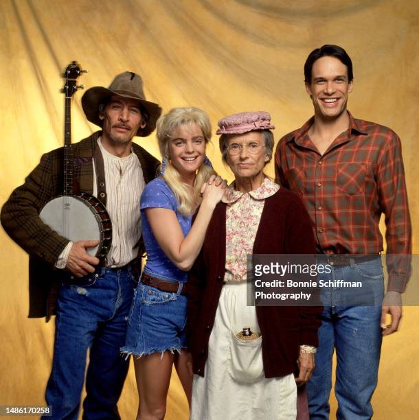 American actor Jim Varney , actress Erika Eleniak, actress Cloris Leachman and actor Diedrich Bader pose in costume for the 1993 comedy film The...