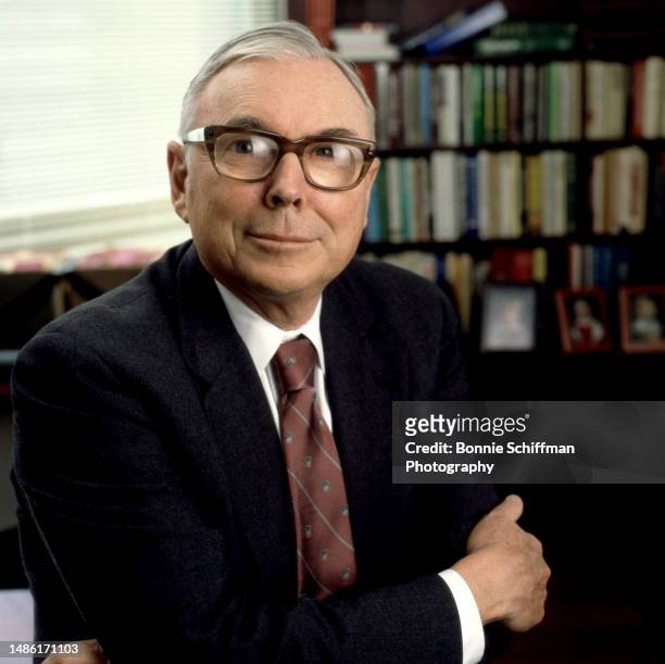 American billionaire investor Charles Munger poses for a portrait with his arms folded in Los Angeles, California, March 9, 1988.