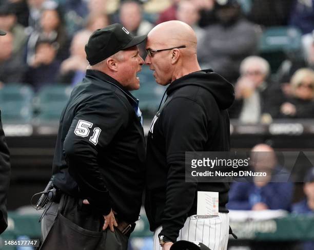 Pedro Grifol of the Chicago White Sox argues with home plate umpire Marvin Hudson before getting ejected during the first inning of a game against...