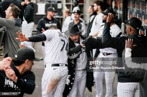 Jake Burger of the Chicago White Sox is congratulated by teammates following a home run during the second inning of a game against the Tampa Bay Rays...