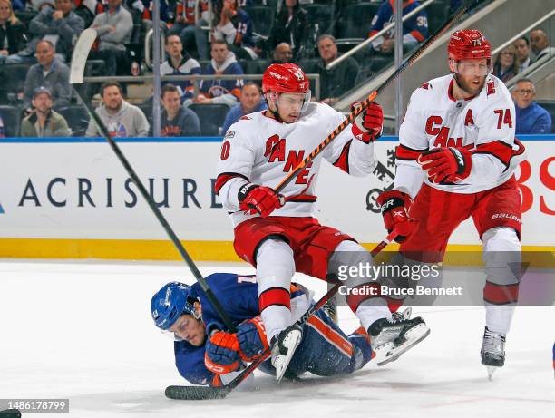 Sebastian Aho of the Carolina Hurricanes checks Mathew Barzal of the New York Islanders during the second period in Game Six of the First Round of...