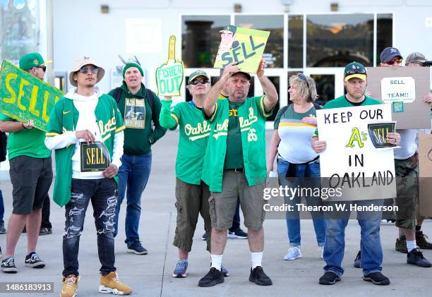 With the decision to move from Oakland to Las Vegas fans of the Oakland Athletics protest with signs outside the stadium prior to the start of the...