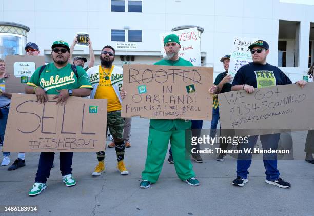 With the decision to move from Oakland to Las Vegas fans of the Oakland Athletics protest with signs outside the stadium prior to the start of the...