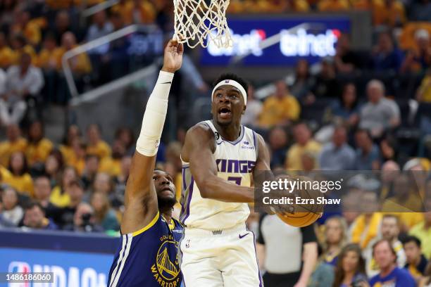 Terence Davis of the Sacramento Kings goes up for a shot on Kevon Looney of the Golden State Warriors in the first half of Game Six of the Western...