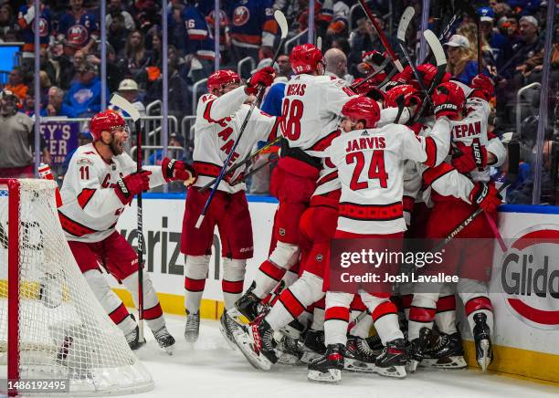 The Carolina Hurricanes celebrate after defeating the New York Islanders in overtime in Game Six of the First Round of the 2023 Stanley Cup Playoffs...