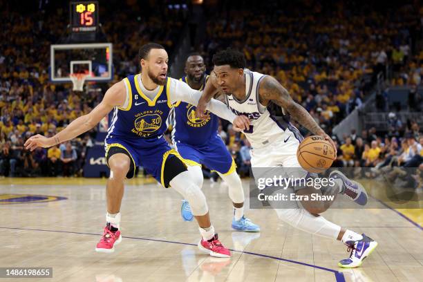 Malik Monk of the Sacramento Kings is guarded by Stephen Curry of the Golden State Warriors in the second half of Game Six of the Western Conference...